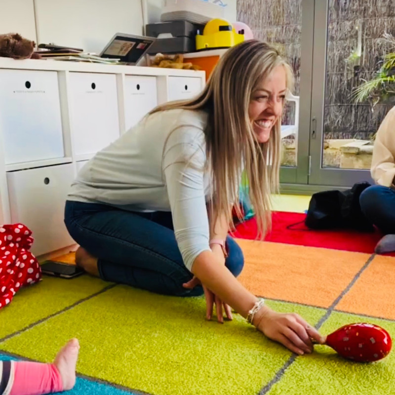 Kimberley Lloyd smiling while leading a Little House of Music class